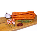 Delumani Cabanos de casa, traditional Romanian mezeluri sausages, sliced and arranged on a wooden platter.